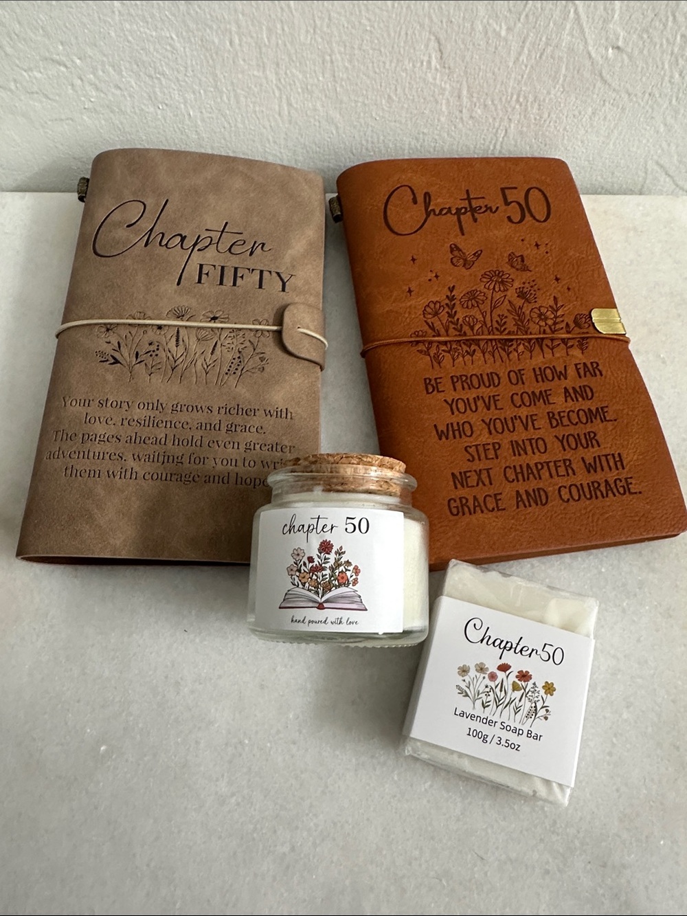 Chapter 50 Lavender Soap Bar with Cream Candle and Brown & Tan Journals